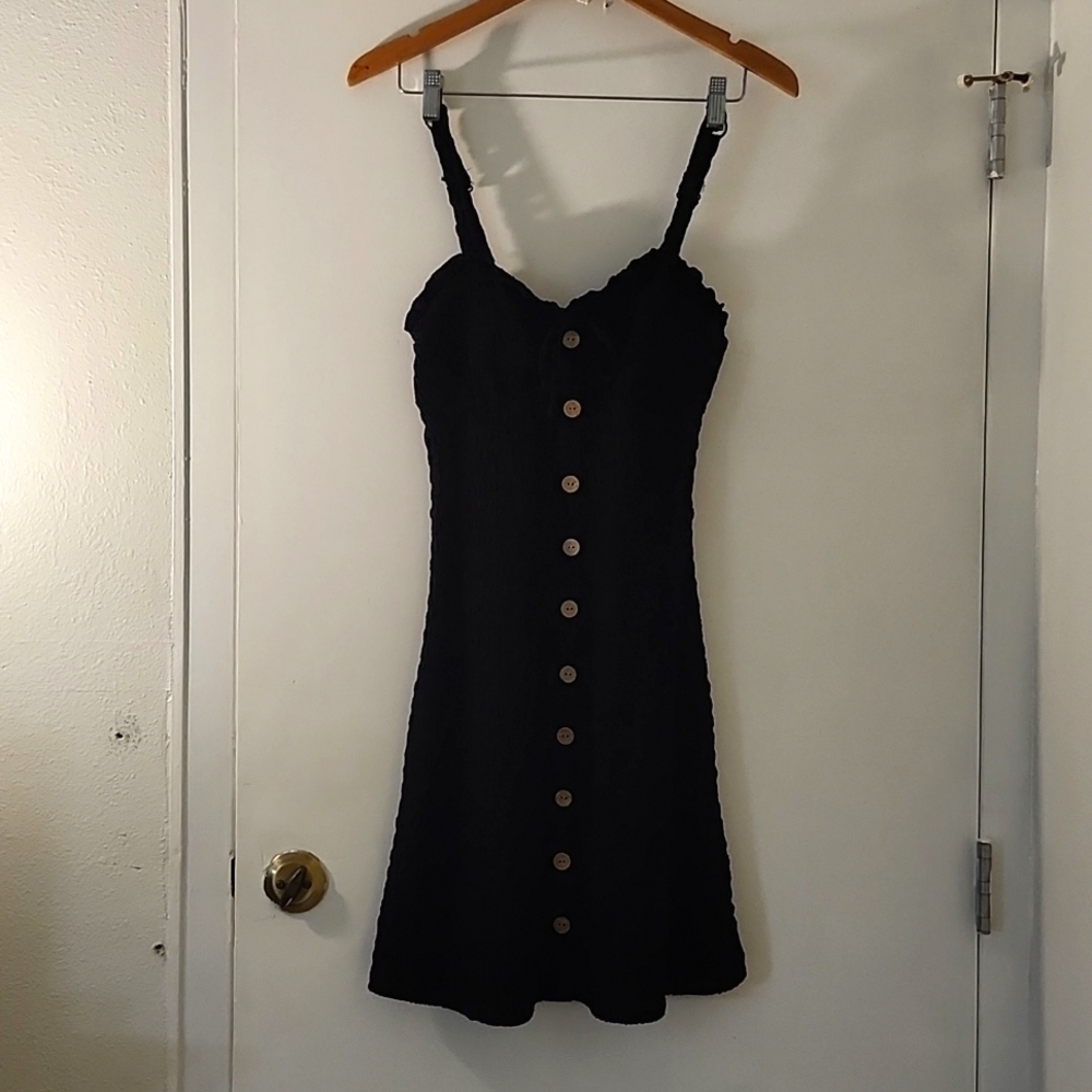 No Boundaries Black W Faux Buttons in front from top to bottom.